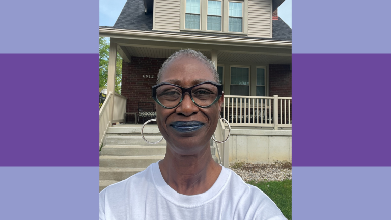 Woman in front of house